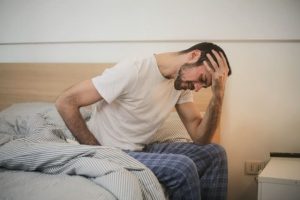 image of a man with a anxiety hangover hangxiety